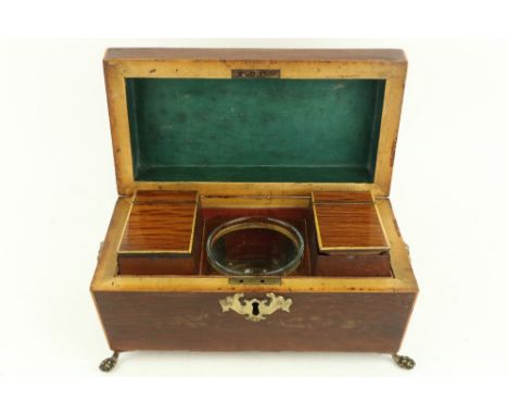 A late Regency period inlaid amboyna wood Tea Caddy, of casket form the interior with two cannisters, and a glass Blending Bo