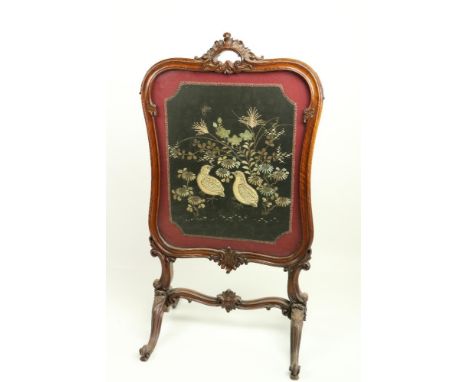 A cartouche shaped Victorian mahogany cheval Firescreen,&nbsp; with stump work and needle work panel on quadruple cabriole po