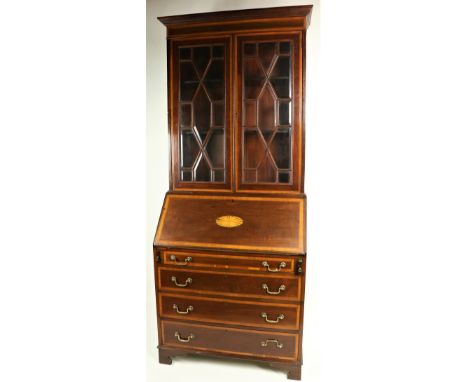 An attractive Edwardian period mahogany inlaid Secretaire Bookcase, of small proportions, the moulded cornice over astragal g