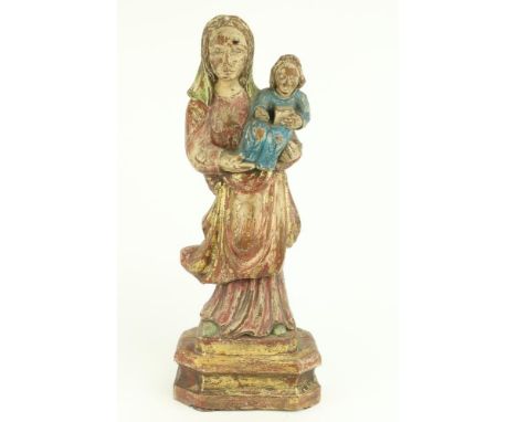 An early Continental carved wooden and polychrome Model of Madonna and Child, approx. 59cms (23") tall, on a shaped plinth ba