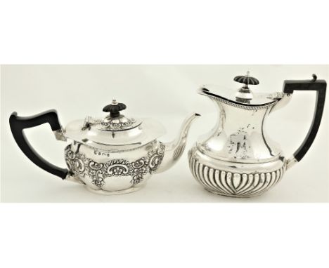 A silver Teapot, with embossed floral and scroll decoration, Birmingham 1904, together with a Birmingham silver Hot Water Pot