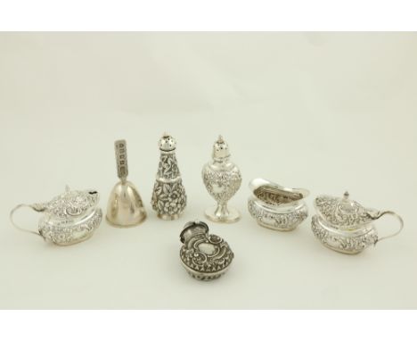 Four similar Birmingham silver Condiments, comprising two mustard pots, an oval boat shaped salt, and a vase shaped pepper ca