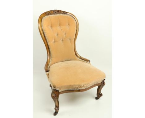 A Victorian Ladies walnut Nursing Chair, with balloon shaped button back, covered in light tan fabric. (1)