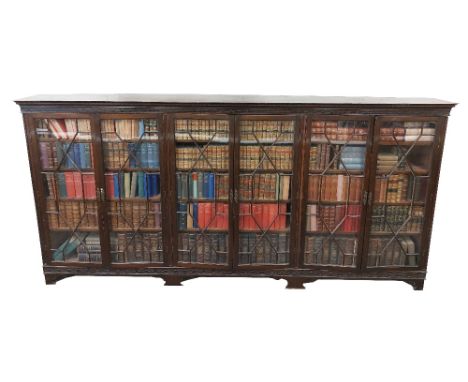 A good quality and unusually large Georgian style six door mahogany&nbsp;Bookcase, of low proportions,&nbsp;by Hicks Dublin, 