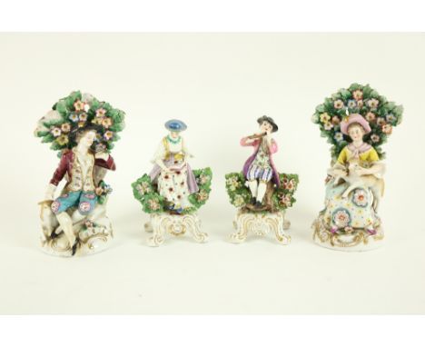A pair of Chelsea style porcelain&nbsp;Groups, one modelled as Gentleman with sheep, the other a Lady with lamb, 17.5cms (7")