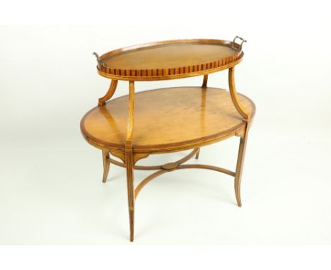 A two tier Edwardian satinwood inlaid and crossbanded Supper Table, with oval shelves, the top with a lift out glass bottom t