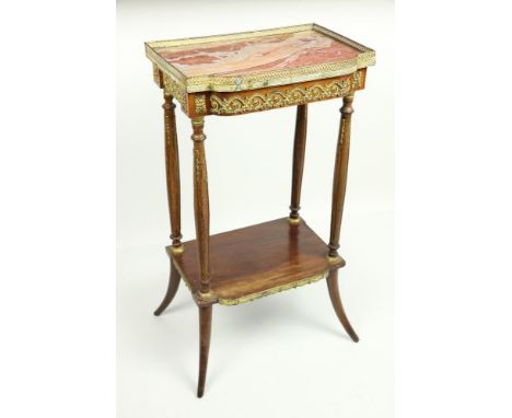 A small French two tier brass mounted Side Stand, with rouge marble top and pierced brass gallery above a bow fronted frieze 