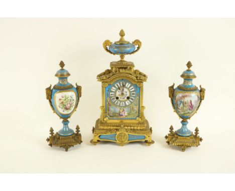 A three piece French gilt brass Mantle Clock Garniture, by Japy Freres, the brass case surmounted by a blue celeste porcelain