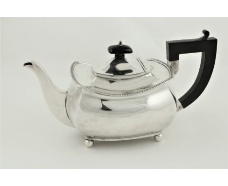 A rectangular ogee shaped silver Teapot, by Atkin Bros., Sheffield c. 1900, with ebonised handle, 23cms (9 1/4") 433g. (1) 