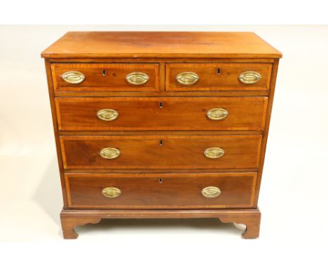 A George IV period mahogany and crossbanded Chest,&nbsp;with three long and two short drawers raised on bracket feet, 97cms (