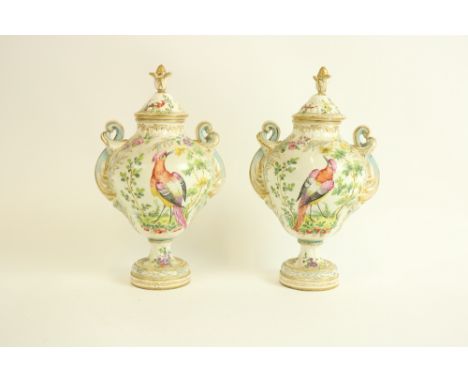 A pair of Chelsea style porcelain Vases and Covers, each decorated with colourful flowers and exotic birds, with two interlac