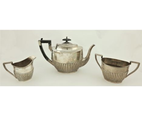 A three piece silver Tea Service, by Walker and Hall, Sheffield c. 1918, comprising an oval half reeded teapot, matching two 