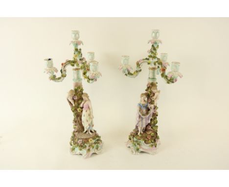 A good large pair of Sitzendorf porcelain three branch - four light Candelabra, late 19th Century, each flower encrusted and 