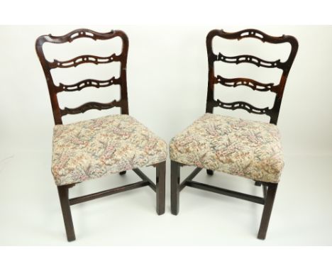 A fine set of 12 - 19th Century mahogany pierced ladder back Chairs, each with four shaped crossrails above a stuff over seat