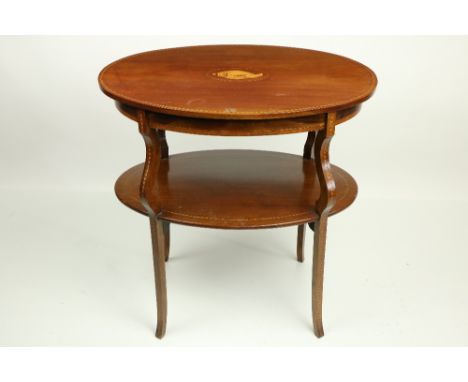 A two tier oval Edwardian inlaid mahogany Occasional Table, with shaped legs and stretcher shelf, 71cms (28"). (1) 