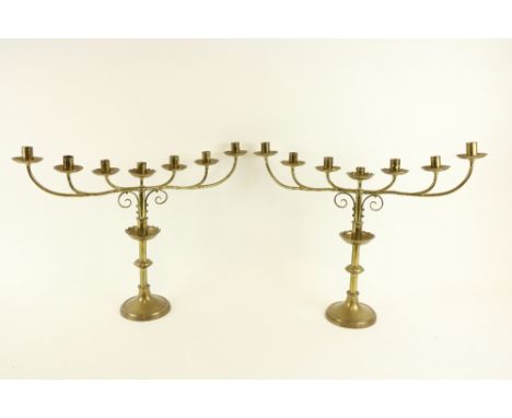 A pair of brass six branch - seven light Altar Candelabra, 17 1/2" x 23" (45cms x 59cms). (2) 