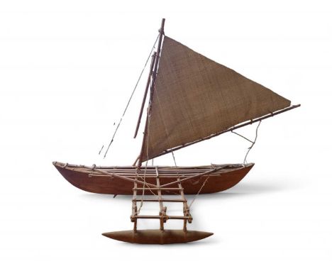 A Scratch-Built Outrigger Canoe Made entirely from wood and organic material fittings, with two wooden oars with triangular s