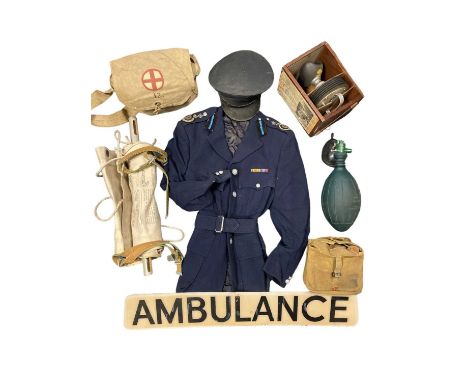 The Ambulance Service Items from a dedicated ambulance service display Including a vintage ambulance sign, a fabric and woode