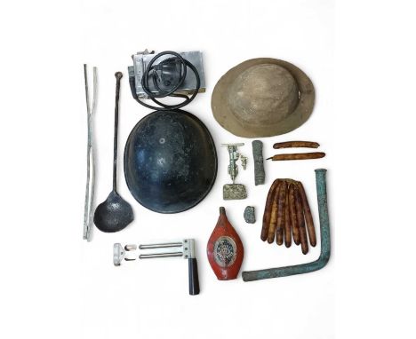Mining An iron smelting ladle, 47cm x 11cm, a model of a Holman rock drill with granite base, 16cm tall, two smelted tin cand