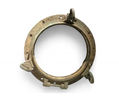 A large brass porthole 59cm diameter.