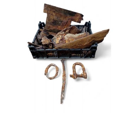 A 19th Century collection of shipwrecked timbers and salvage Including an iron nail 25cm in length and salvage from an early 