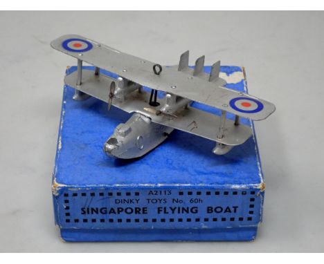A boxed Dinky Toys No.60h Singapore Flying Boat, version with red plastic roller 