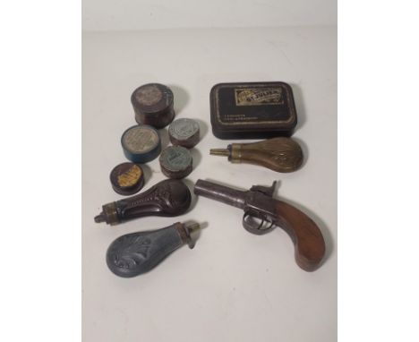 A 19th Century box lock Percussion Pocket Pistol, three small Pistol Powder Flask, five Percussion Cap Tins and a Rifle Pull 