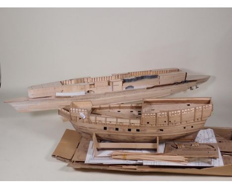 Two part built wooden Models of Ships, a plastic kit built Model of a German military Motorbike and Side Cart and five boxes 