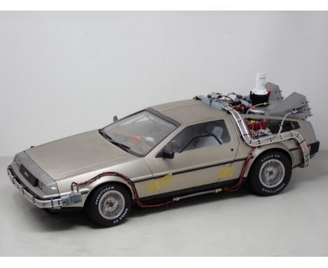 A large scale kit built metal Model of the 'Back to the Future' Delorean 1ft 9in L 