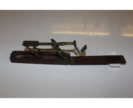 A set of mahogany cased folding sovereign scales