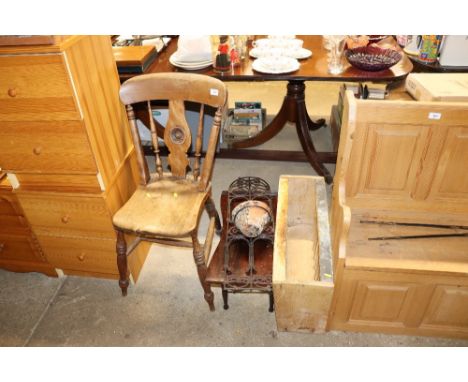 A pine plate rack; a dining chair; a bed table and a wall planter