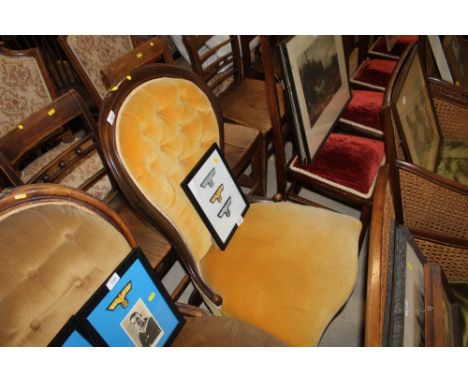 A Victorian mahogany spoon back button down upholstered chair 