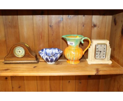 An Art Deco mantel clock; a Roskyl Pottery jug; an Oriental dish character marks to base; and a chequer banded and inlaid man