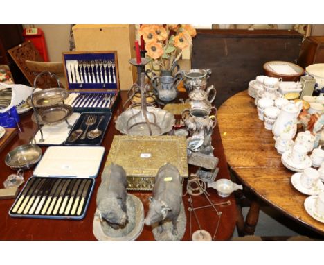 A quantity of various metal ware to include brass embossed trinket box, teaware, candlestick, two cattle ornaments etc.