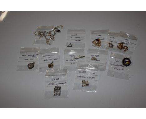 A silver charm bracelet; various small silver charms etc.