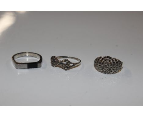 A marcasite set bow ring; an Art Deco marcasite ring and a white metal and stone set 1980's ring 