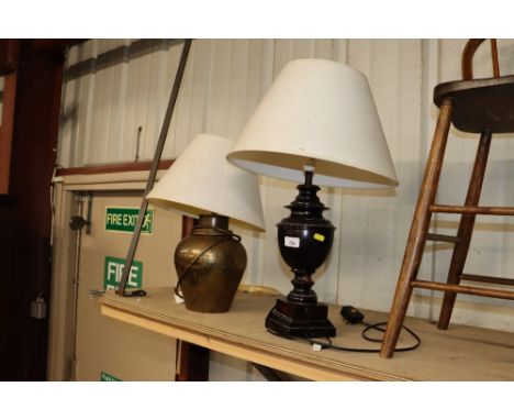 A brass table lamp and shade and one other