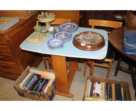A vintage Formica topped gate leg table with two chairs