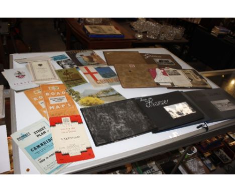 A collection of vintage photographs, maps etc.