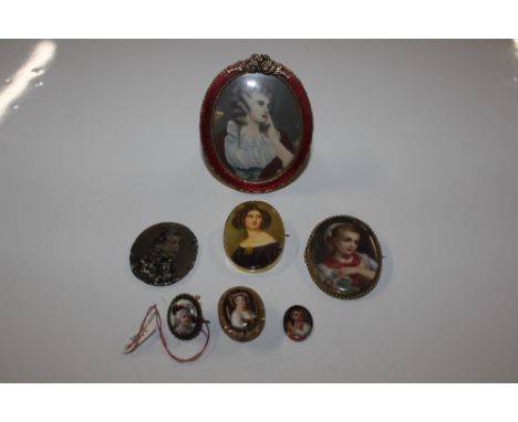 A miniature portrait in oval enamel decorated frame and various other porcelain miniature portraits etc