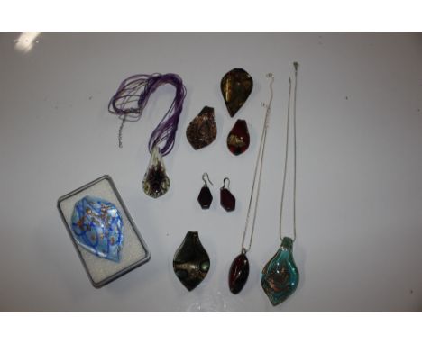 A collection of Venetian glass pendants and Sterling silver snake chains 