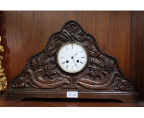 Ornate carved mantle clock