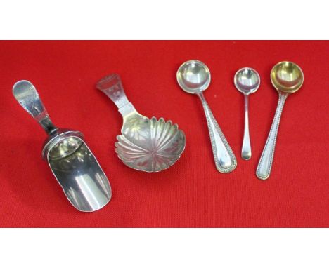 A silver 'coal scuttle' form caddy shovel, together with one other silver caddy spoon and three condiment spoons