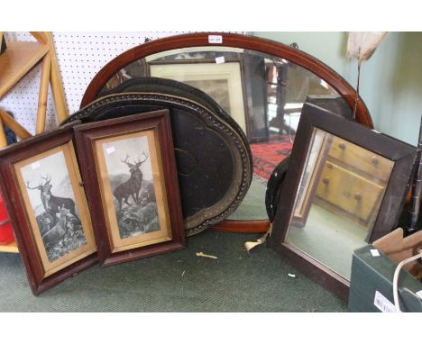 An Edwardian oval framed wall mirror, other mirrors, Pair of framed Stag prints and an oval tin tray