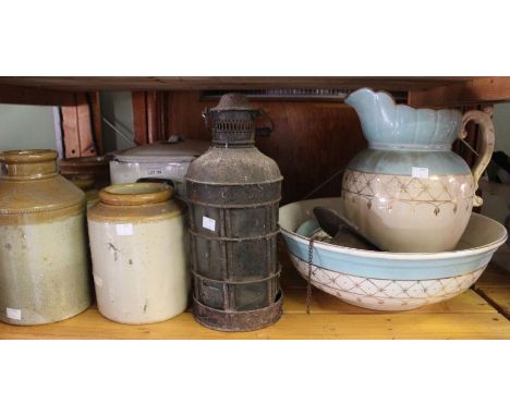 A pottery wash bowl set, lantern, enamel bread bin, four stoneware jars and a small wall clock