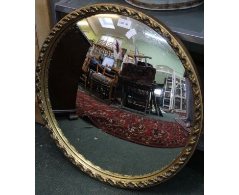 Gilt framed convex wall mirror