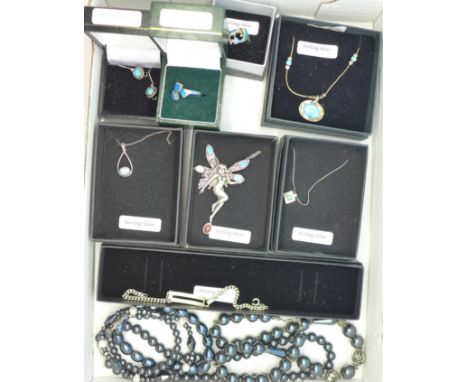 Jewellery including synthetic opal set