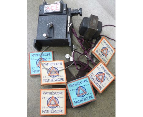 A Pathescope Ace 9.5mm film projector and six 9.5mm films including Popeye