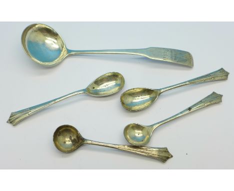 A 19th Century Clan Munro silver cream ladle, two silver salt spoons and two matching silver mustard spoons (5)