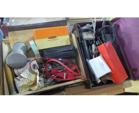 A collection of vintage doctors equipment in two leather cases 